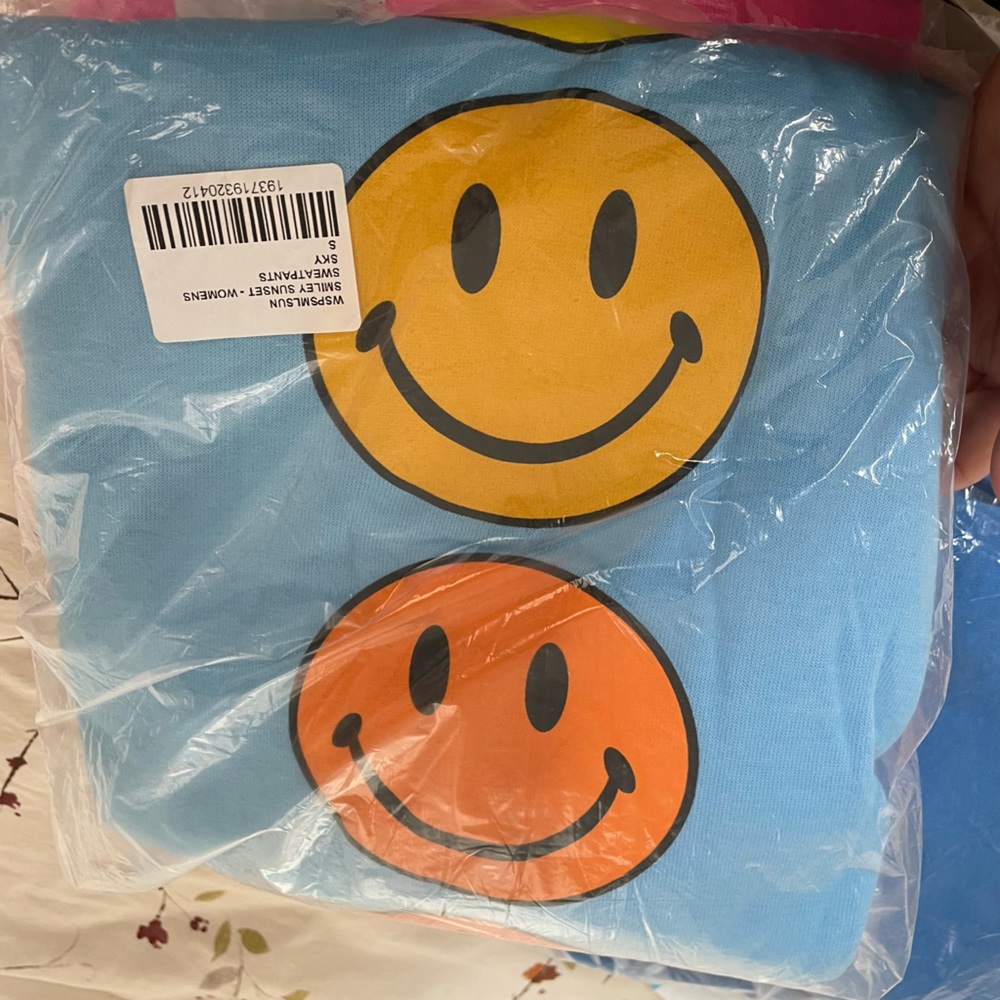 Aviator Nation smiley face sweatpants, ordered the wrong size by accident.